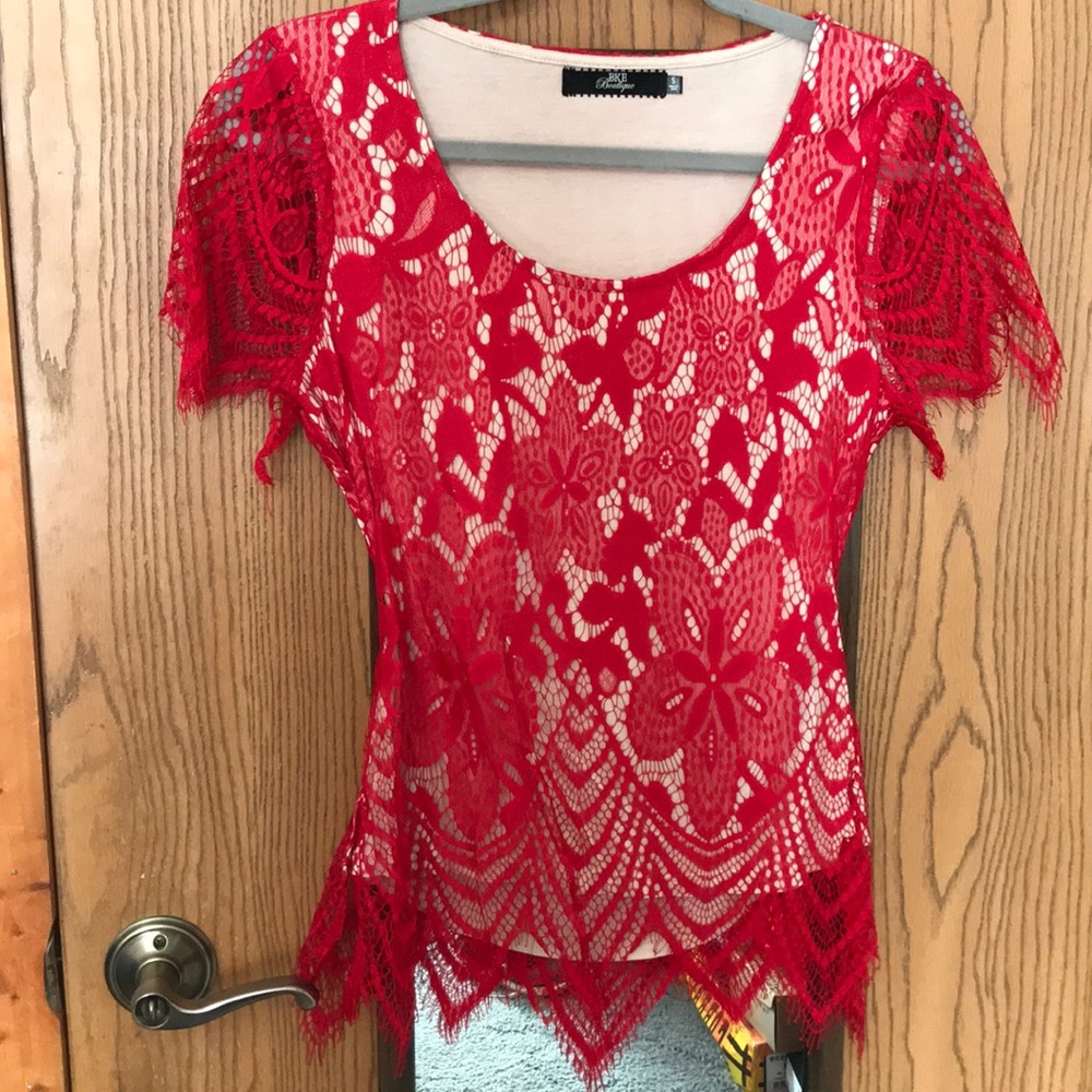BKE Boutique lacey top with back cut-out.